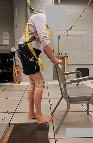 A heel tap stimulates sensors used to measure damping in an osteoporosis patient.
