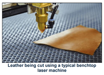 a strip of leather being cut by a laser