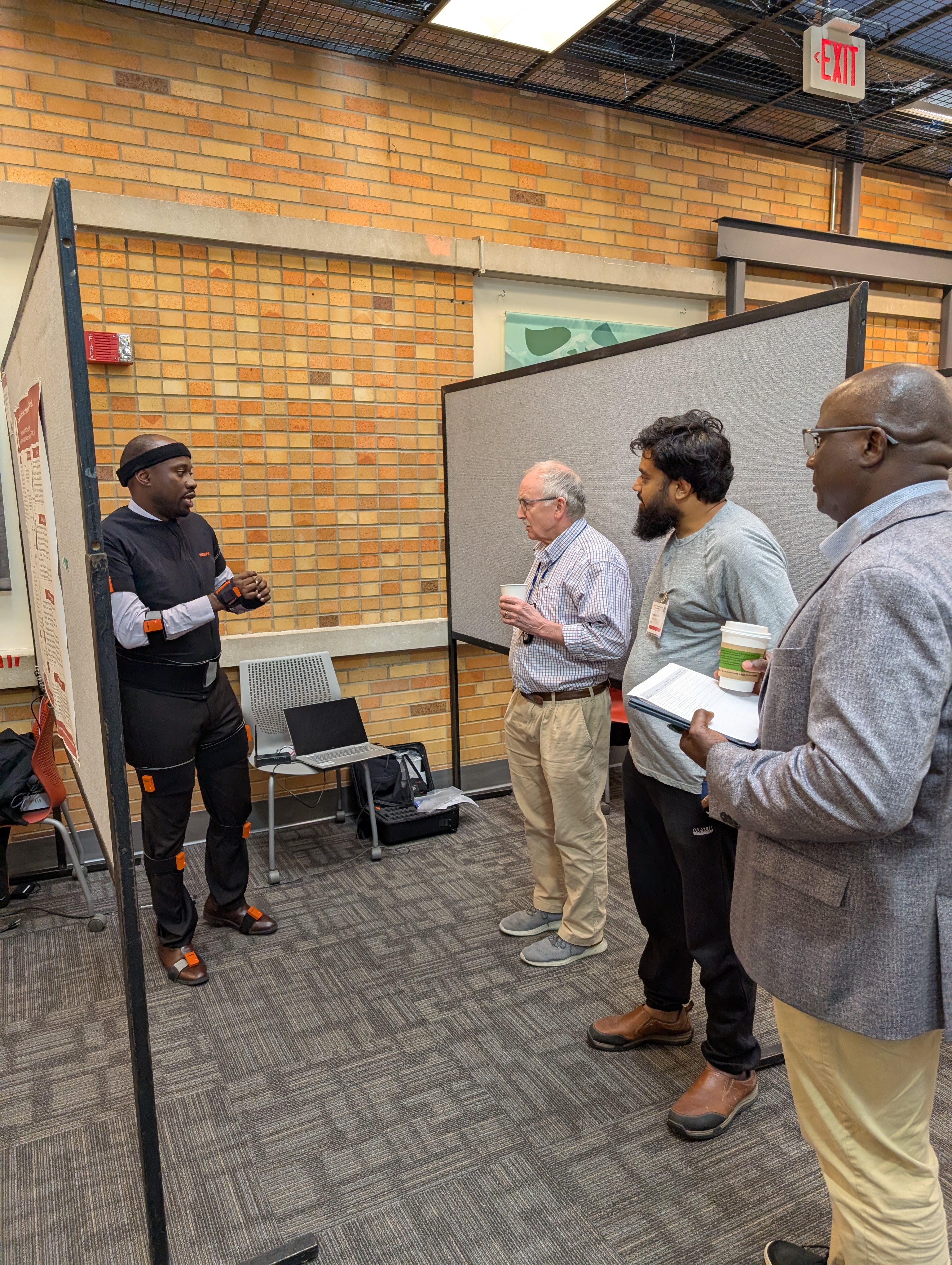 people gather at a poster session 