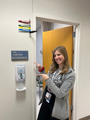 Faculty member standing in the doorway.