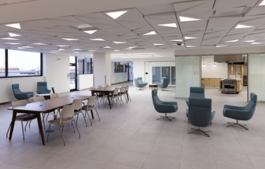 community area with tables and chairs in the osher wellness suite