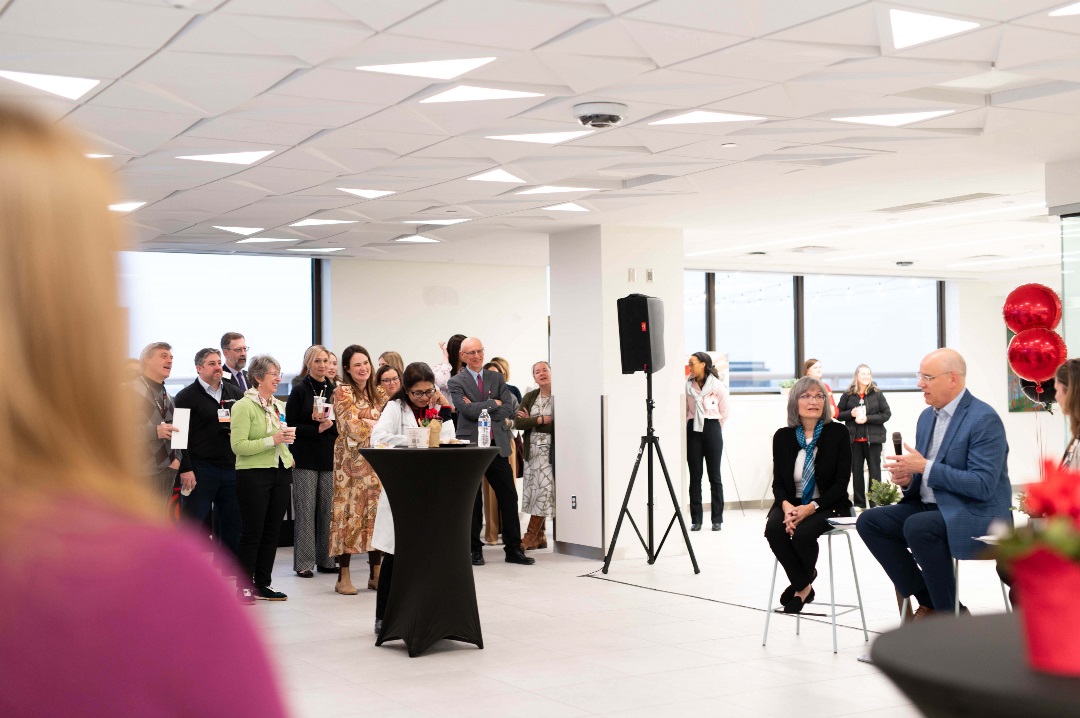 A group of people at an event watching a speaker at the Osher Wellness Suite