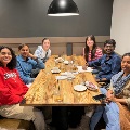 6 people at wooden table