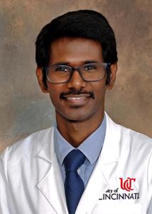 Photo of Karthickeyan  Chella Krishnan with UC lab coat